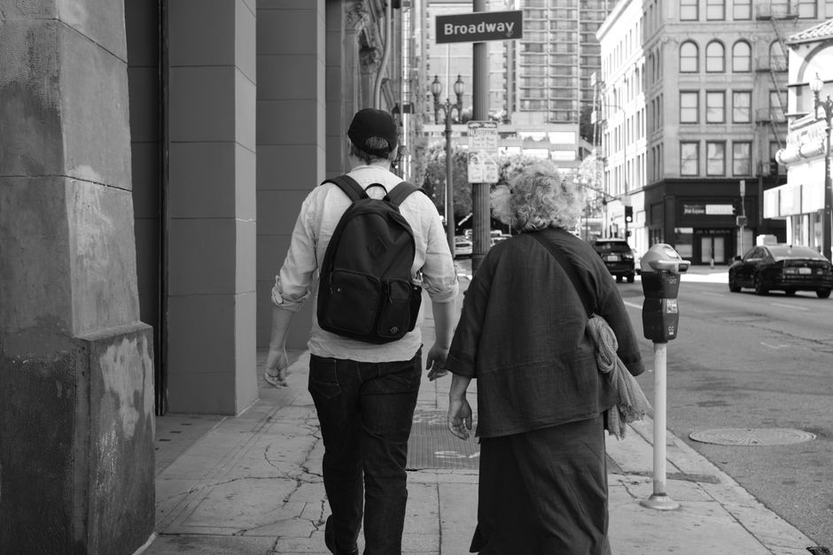 Casual street scene capturing people walking on Broadway. Urban lifestyle vibe.