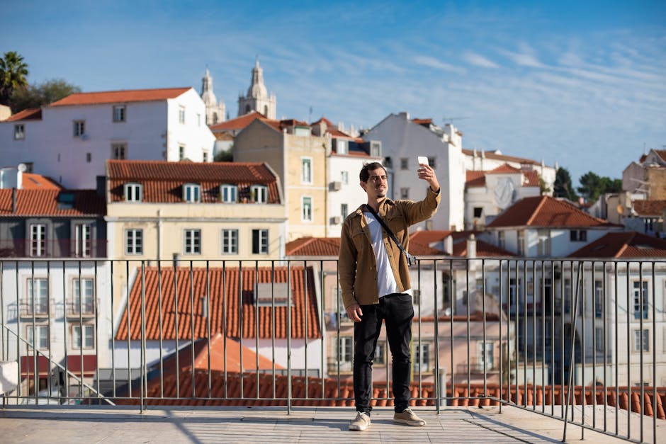 Casual traveler capturing a selfie amidst Lisbon's iconic architecture.